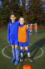 Portrait smiling, confident girls soccer players — Stock Photo
