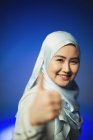 Portrait smiling, confident young woman in blue silk hijab gesturing thumbs-up — Stock Photo