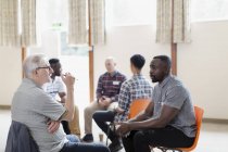 Men talking in group therapy — Stock Photo