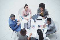 High angle view business people meeting at round table — Stock Photo