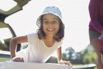 Portrait confident, happy girl in sun hat — Stock Photo