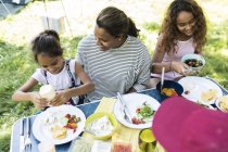 Family enjoying lunch at campsite — Stock Photo