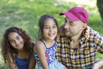 Portrait happy father and daughters — Stock Photo