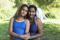 Portrait affectionate mother and daughter at campsite — Stock Photo