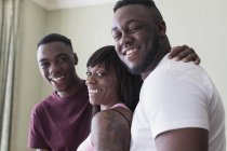 Portrait happy mother and teenage sons — Stock Photo