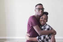 Portrait affectionate teenage brother and sister hugging — Stock Photo