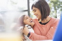 Happy, affectionate mother and daughter hugging — Stock Photo
