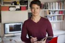 Portrait confident man working in home office — Stock Photo