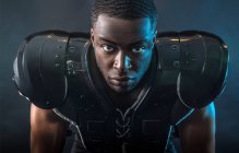 Portrait confident, tough football player wearing pads — Stock Photo