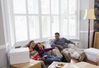 Family taking a break from packing, moving house — Stock Photo