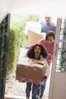 Excited family moving into new house — Stock Photo