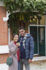 Portrait confident couple with house keys outside new house — Stock Photo