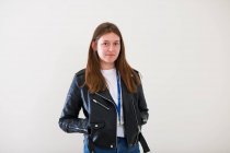 Portrait confident young woman wearing leather jacket — Stock Photo