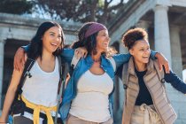 Happy, carefree mother and daughters walking — Stock Photo