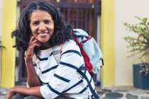 Portrait of confident, smiling woman backpacking — Stock Photo
