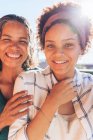 Portrait of smiling, confident mother and daughter — Stock Photo