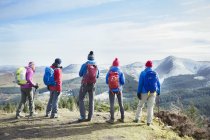 Back view of Family hiking on mountain — Stock Photo