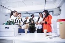 Businesswomen celebrating new office with champagne — Stock Photo
