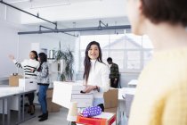Businesswomen moving into new office — Stock Photo