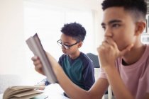 Teenage boys doing homework — Stock Photo