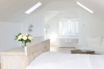 White a-frame home showcase bedroom with en suite bathroom — Stock Photo