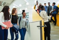 Junior high students hanging out on stairs — Stock Photo