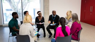 People talking in support group meeting circle in community center — Stock Photo