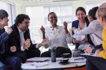 Excited business people cheering in meeting — Stock Photo