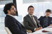 Portrait confident businessmen in conference room meeting — Stock Photo