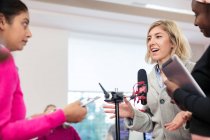 Community college journalism students at microphone in classroom — Stock Photo