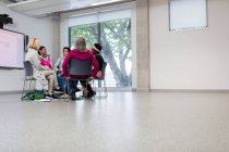 Women talking in support group circle in community center — Stock Photo