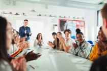 High school students and teacher clapping debate class — Stock Photo