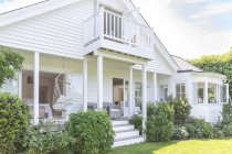 Home showcase exterior white house with patio and garden — Stock Photo