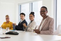 Portrait smiling, confident business people in conference room meeting — Stock Photo