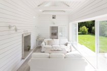 White wood shiplap a-frame home showcase sunroom — Stock Photo