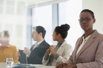 Portrait confident businesswoman in conference room meeting — Stock Photo