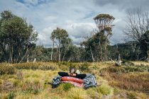 Carefree woman relaxing in woods Alpine National Park Australia — Stock Photo