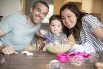 Portrait happy young family baking — Stock Photo