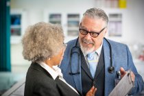 Senior doctors consulting in clinic — Stock Photo