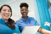 Portrait smiling, confident female doctor and nurse in hospital — Stock Photo
