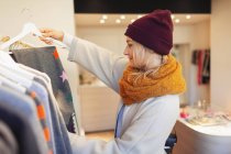 Young woman shopping clothes — Stock Photo