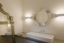 Home showcase interior bathroom sink and mirror — Stock Photo