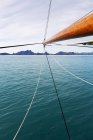 Sailboat mast over sunny blue Atlantic Ocean — Stock Photo