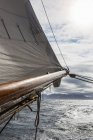 Sailboat mast over sunny ocean — Stock Photo