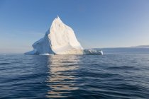 Majestic iceberg on sunny tranquil blue Atlantic Ocean Greenland — Stock Photo