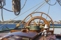 Wooden sailboat helm steering wheel — Stock Photo
