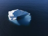 Drone point of view majestic iceberg on sunny blue Atlantic Ocean Greenland — Stock Photo
