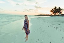 Portrait happy woman in sun dress on tranquil tropical ocean beach Mexico — Stock Photo