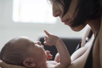 Close up mother holding newborn baby son — Stock Photo