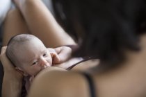 Mother breastfeeding newborn baby son — Stock Photo